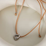 Brown Velvet Cord Necklace with Irregular Silver Pendant